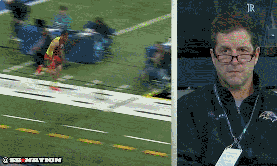 SB Champion Coach Jim Harbaugh reacts to Manti Te'o's 40 yard dash at the NFL combine